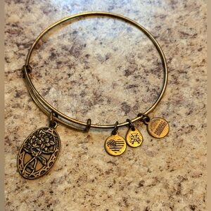 Alex and Ani Because I Love You Friend charm bangle featuring a floral pendant